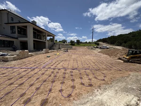 Septic drip lines installed across a graded lot at a new construction home in Central Texas